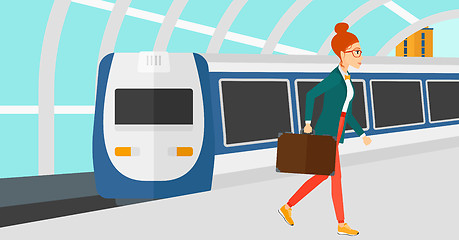 Image showing Woman going out of train.