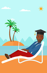 Image showing Graduate lying on chaise lounge with laptop.