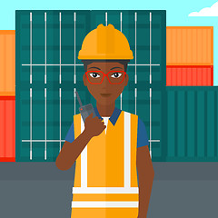 Image showing Stevedore standing on cargo containers background.