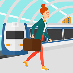 Image showing Woman going out of train.