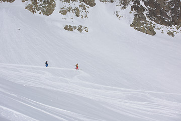 Image showing freeride skier skiing in deep powder snow