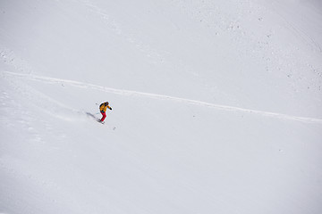 Image showing freeride skier skiing in deep powder snow