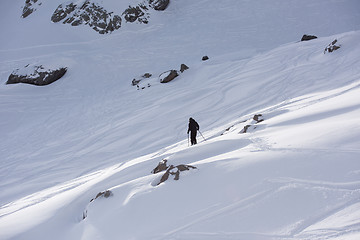 Image showing freeride skier skiing in deep powder snow