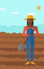Image showing Farmer on the field with shovel.
