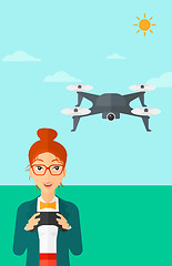 Image showing Woman flying drone.