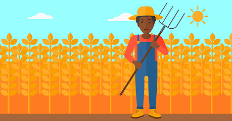 Image showing Farmer with pitchfork.