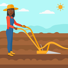 Image showing Farmer on the field with plough.