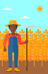 Image showing Farmer on the field with scythe.