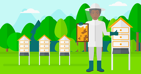 Image showing Bee-keeper at apiary.
