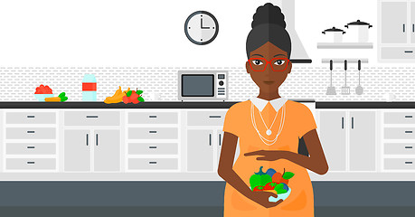 Image showing Pregnant woman with vegetables.