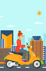 Image showing Woman riding scooter.