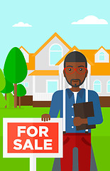 Image showing Real estate agent offering house.