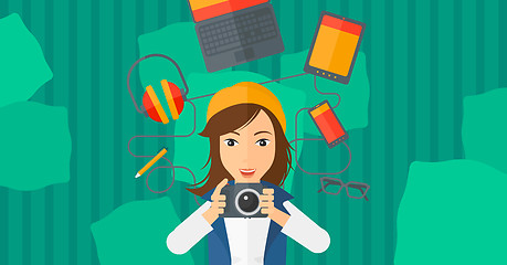 Image showing Woman holding camera.