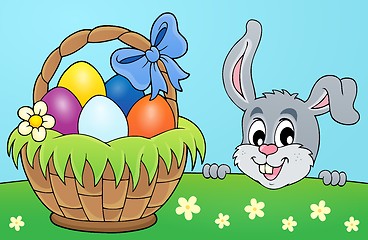 Image showing Decorative egg basket and lurking bunny