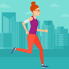 Image showing Woman jogging with earphones and smartphone.