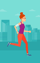 Image showing Woman jogging with earphones and smartphone.