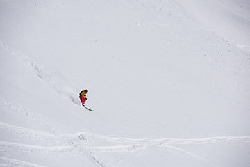 Image showing freeride skier skiing in deep powder snow