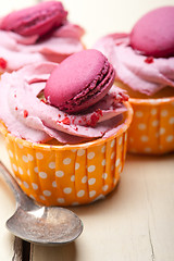 Image showing pink berry cream cupcake with macaroon on top