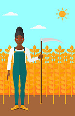 Image showing Farmer on the field with scythe.