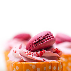 Image showing pink berry cream cupcake with macaroon on top