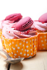 Image showing pink berry cream cupcake with macaroon on top