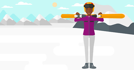 Image showing Woman holding skis.