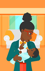 Image showing Woman feeding baby.