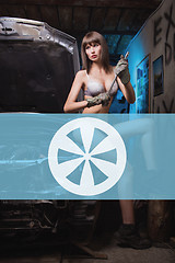 Image showing Icon car repairs on the background of a woman mechanic