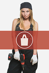 Image showing sexy female holding a cordless screwdriver. Repair icon in the background woman. purchases