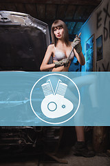 Image showing Icon car repairs on the background of a woman mechanic. engine