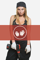 Image showing sexy female holding a cordless screwdriver. Repair icon in the background woman.