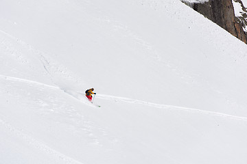 Image showing freeride skier skiing in deep powder snow