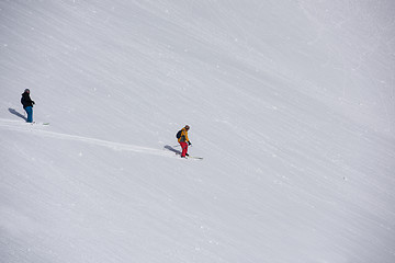 Image showing freeride skier skiing in deep powder snow