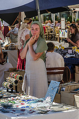 Image showing Master crafts sell their products on the medieval market