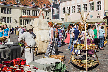 Image showing Master crafts sell their products on the medieval market