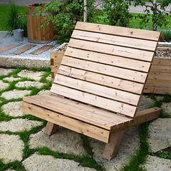 Image showing Wooden garden armchair, close up