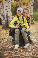 Image showing Woman and her son with camera