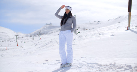 Image showing Attractive young woman standing in winter snow