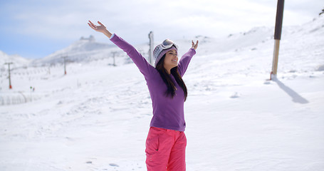 Image showing Happy young woman celebrating her winter vacation