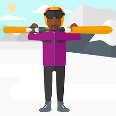 Image showing Man holding skis.