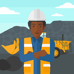 Image showing Miner with mining equipment on background.