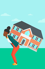 Image showing Woman carrying house.