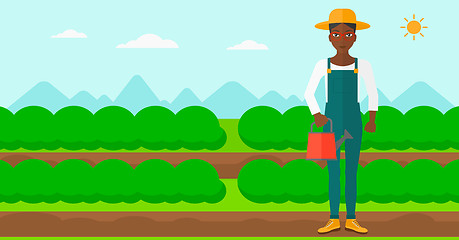 Image showing Farmer with watering can.