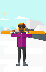 Image showing Man holding skis.