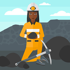 Image showing Miner holding coal in hands.