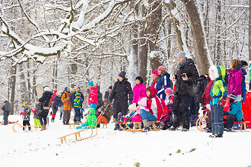 Image showing Winter fun, snow, family sledding at winter time.