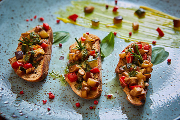 Image showing Vegan food: bruschetta with bell pepper, tomatoes, arugula, thyme and basil