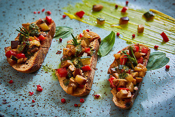 Image showing Vegan food: bruschetta with bell pepper, tomatoes, arugula, thyme and basil
