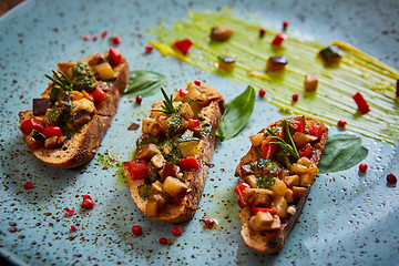 Image showing Vegan food: bruschetta with bell pepper, tomatoes, arugula, thyme and basil