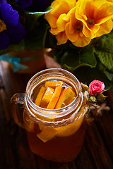 Image showing Ginger tea with orange, spices and honey.